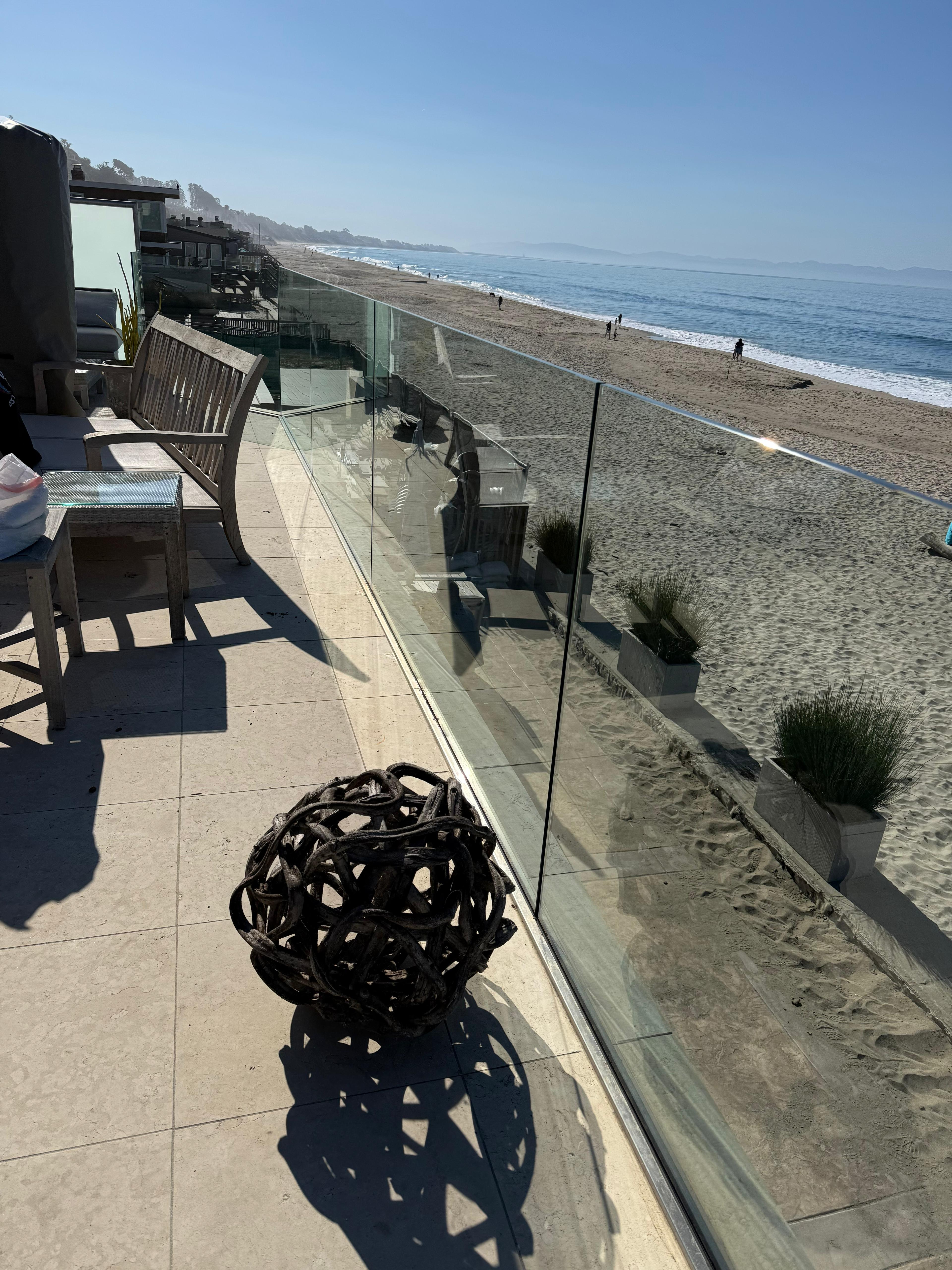 Beach house glass railing cleaning